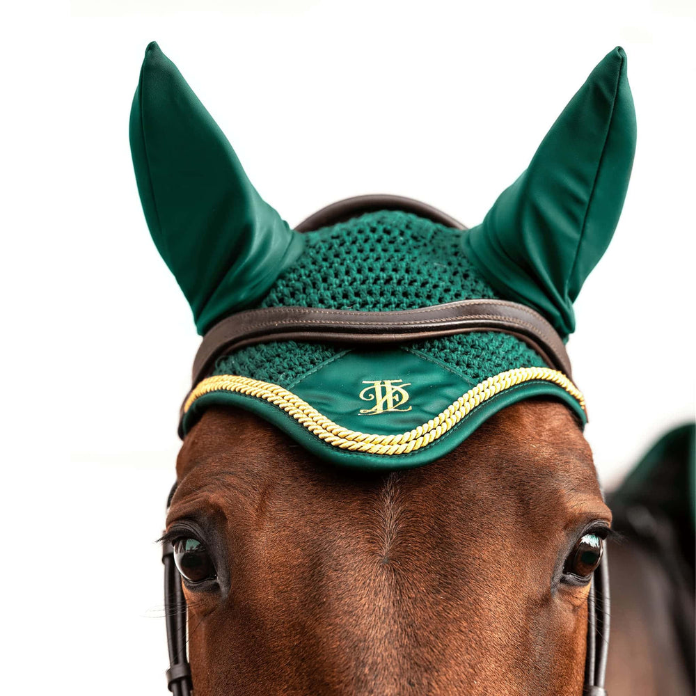 
                  
                    Green fly veil with gold cord trim, modelled on bay horse, on white background.
                  
                